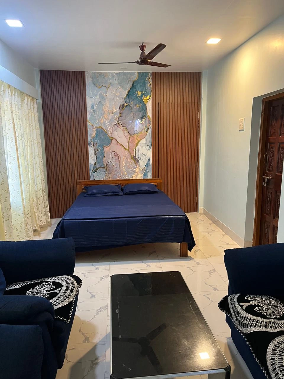 Deluxe family room near Nagaon Beach with pool view at Dolphin House Alibaug